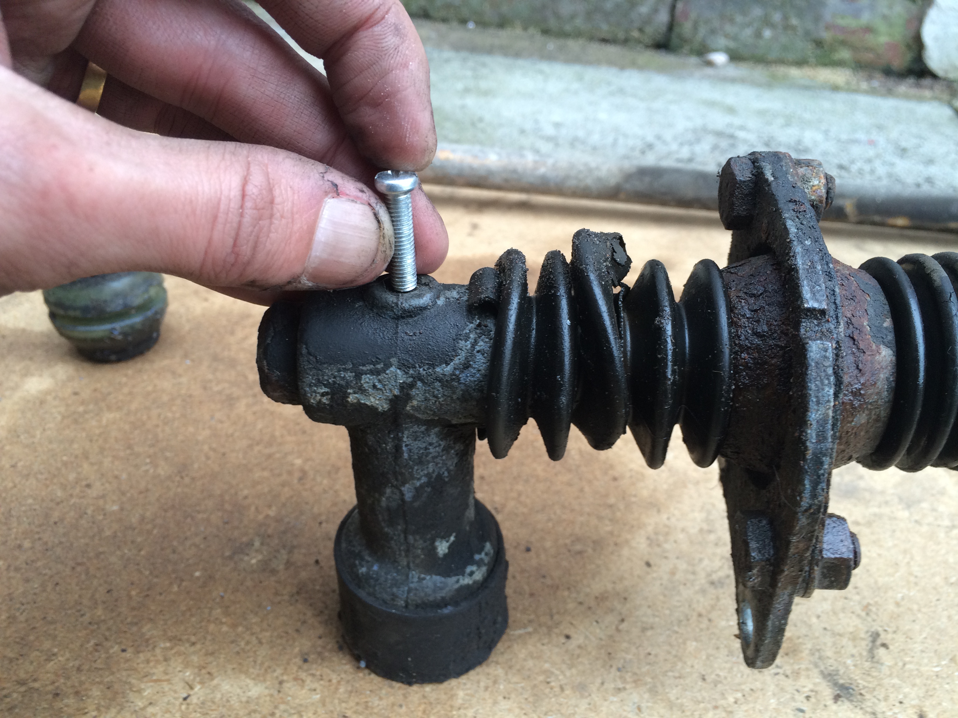 Hammer out roll pin with similar diameter bolt