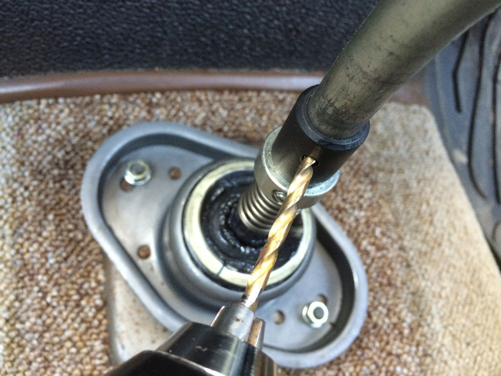 Drilling new indent with 14mm bit using plastic sleeve as guide