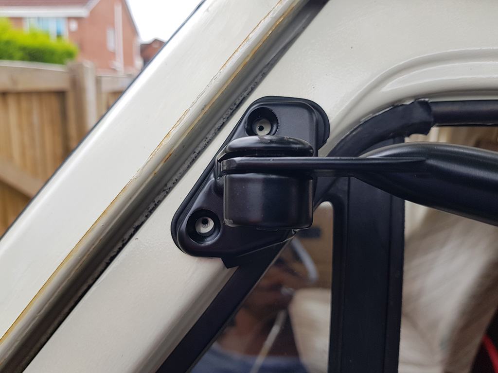 Guide holes drilled for upper bracket screws